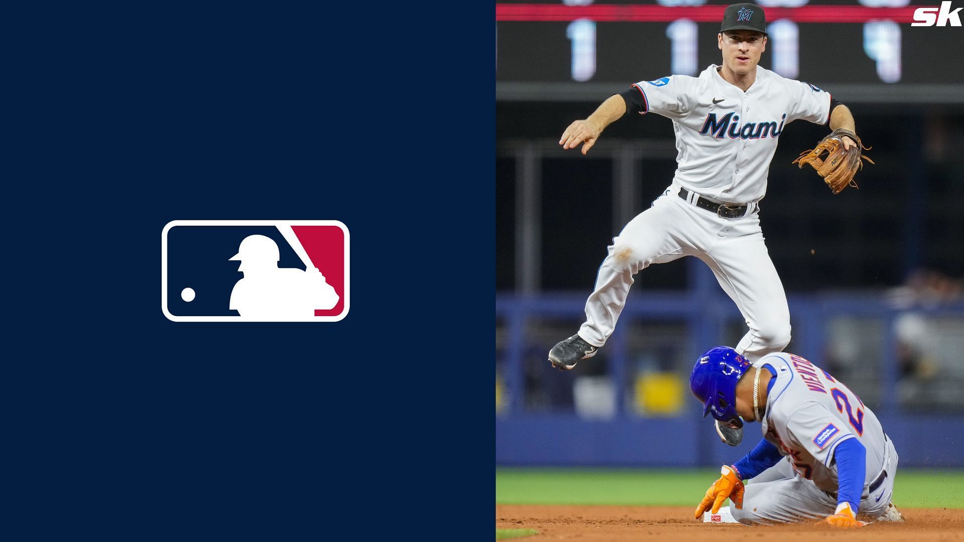 Joey Wendle of the Miami Marlins leaps over Mark Vientos of the New York Mets during the fifth inning at loanDepot park