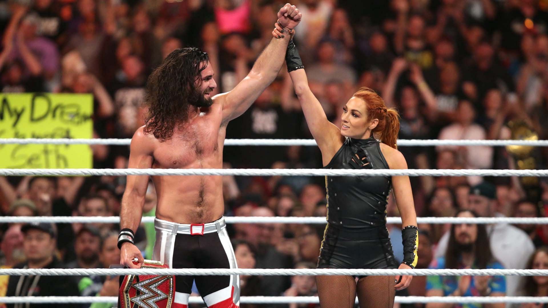 Seth Rollins and Becky Lynch celebrate in the WWE ring