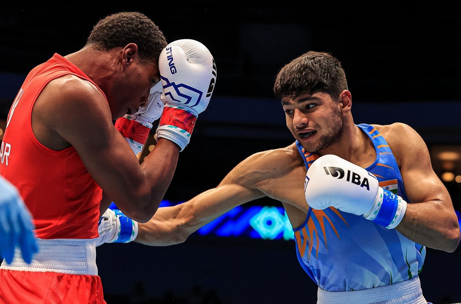 Nishant Dev (blue ) in action for India