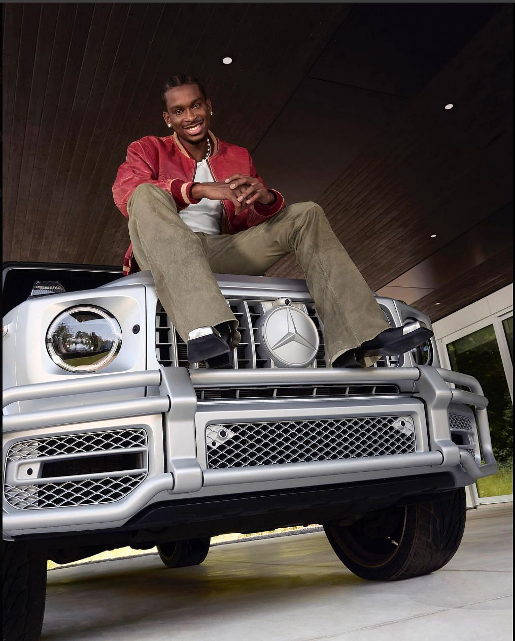 Shai Gilgeous-Alexander models atop a G-Wagon