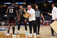 Head coach Buzz Williams of the Texas A&M Aggies huddles with his team during the final minute of the second half against the Houston Cougars.
