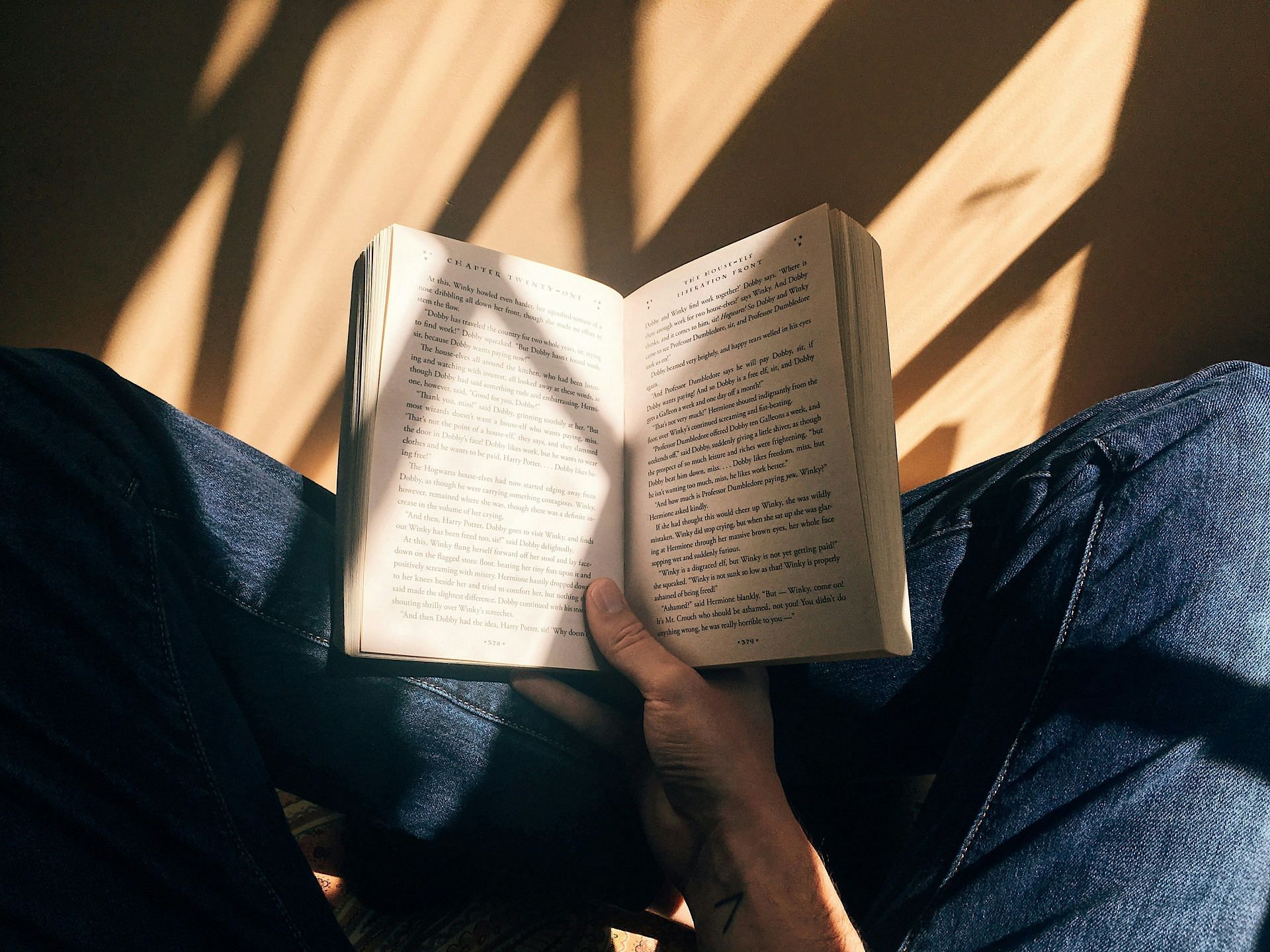 Gambling addiction treatment: Keep yourself busy by reading a book or just hearing some music (Image by Blaz Photo/Unsplash)