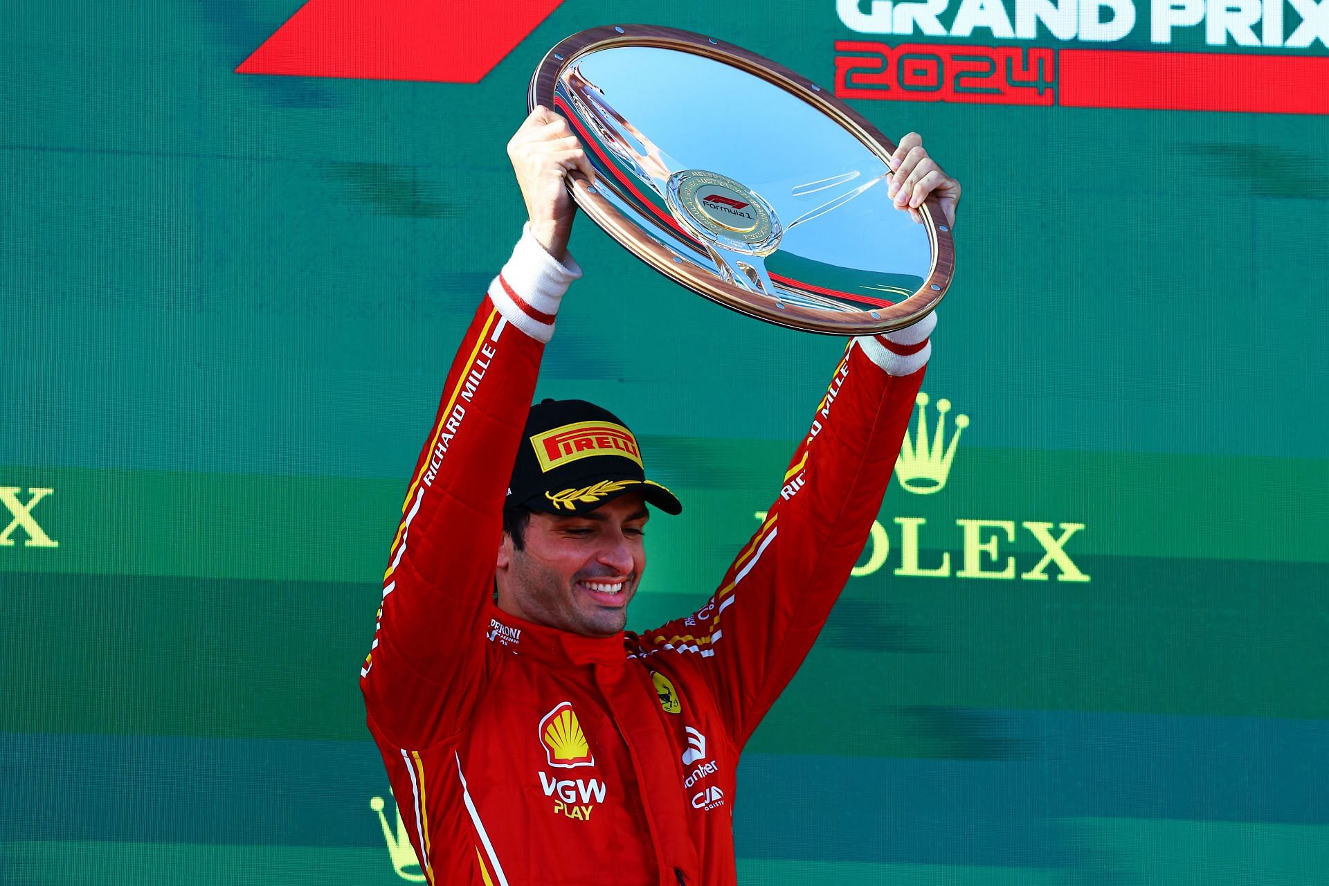 Race winner Carlos Sainz of Spain and Ferrari celebrates on the podium during the F1 Grand Prix of Australia at Albert Park Circuit on March 24, 2024 in Melbourne, Australia. (Photo by Mark Thompson/Getty Images)