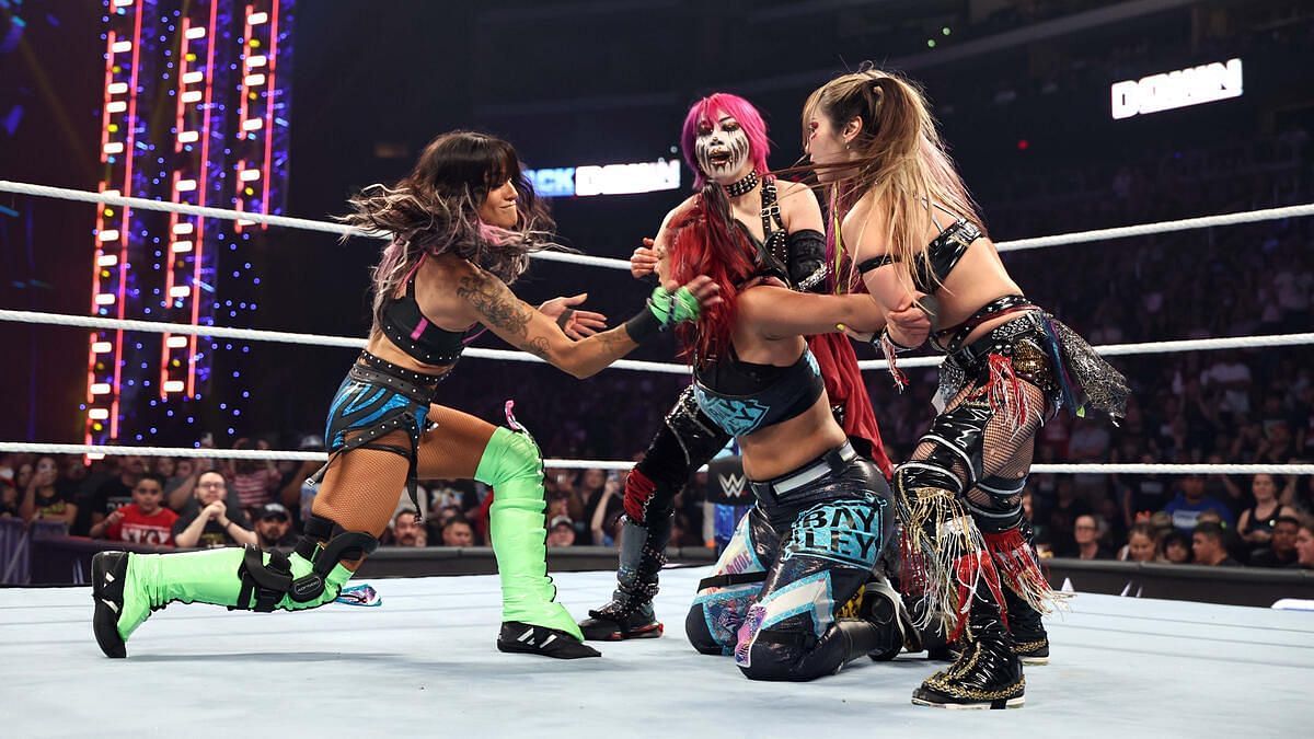 Damage CTRL attacking Bayley after the match on SmackDown.
