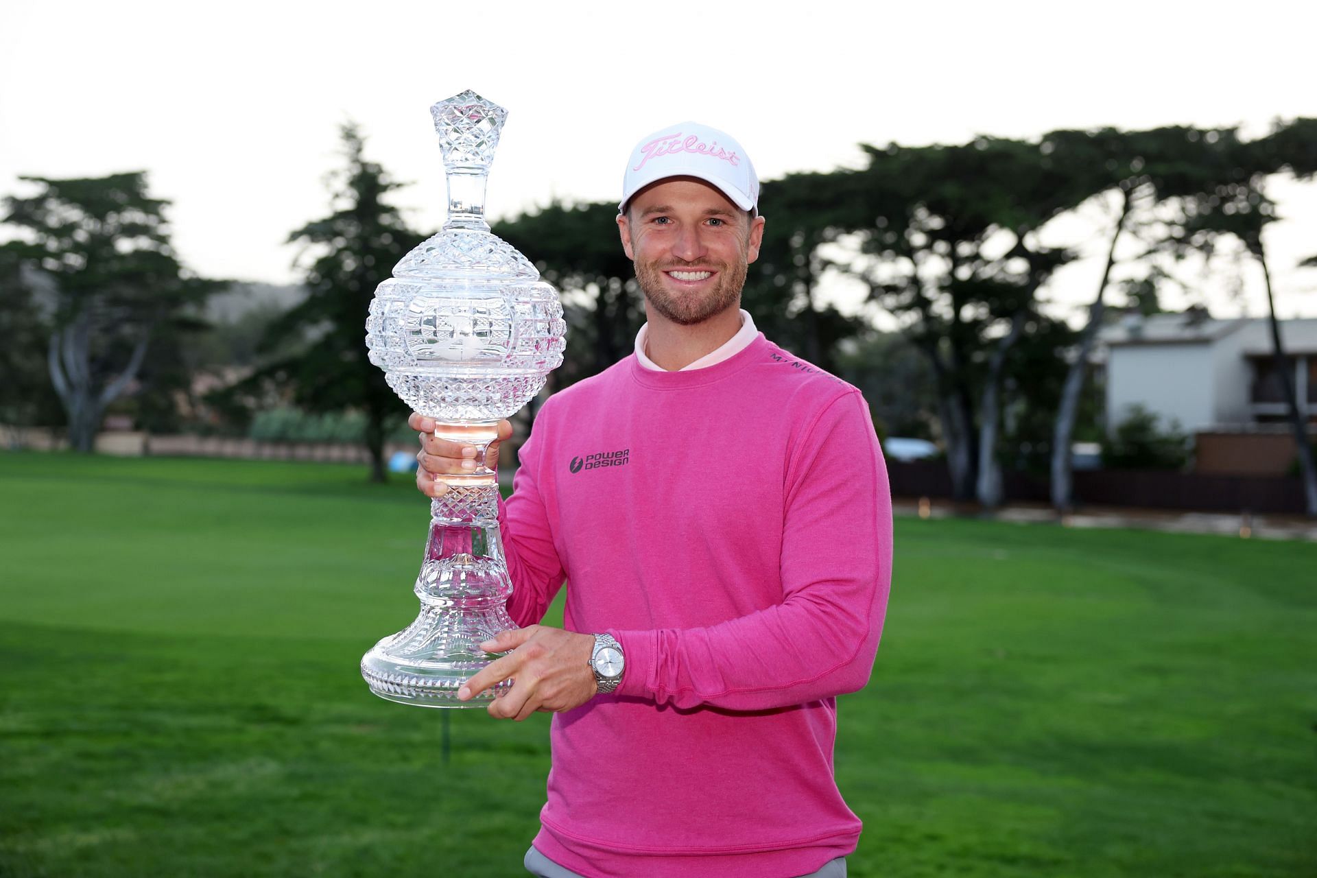 Wyndham Clark lifts the trophy after winning the AT&amp;T Pebble Beach Pro-Am 2024