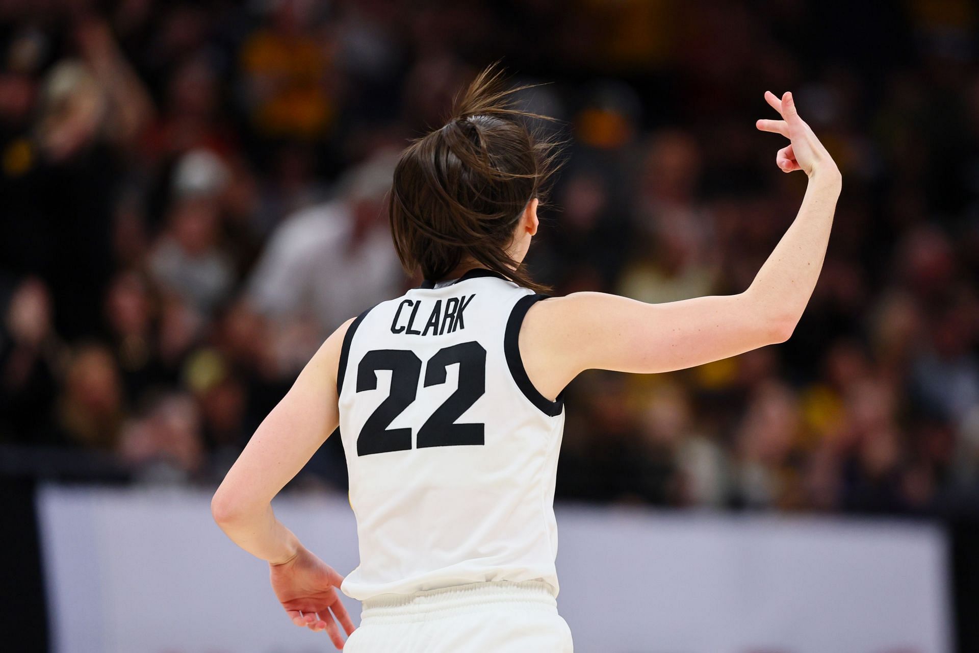 Caitlin Clark #22 of the Iowa Hawkeyes reacts after a three point basket.