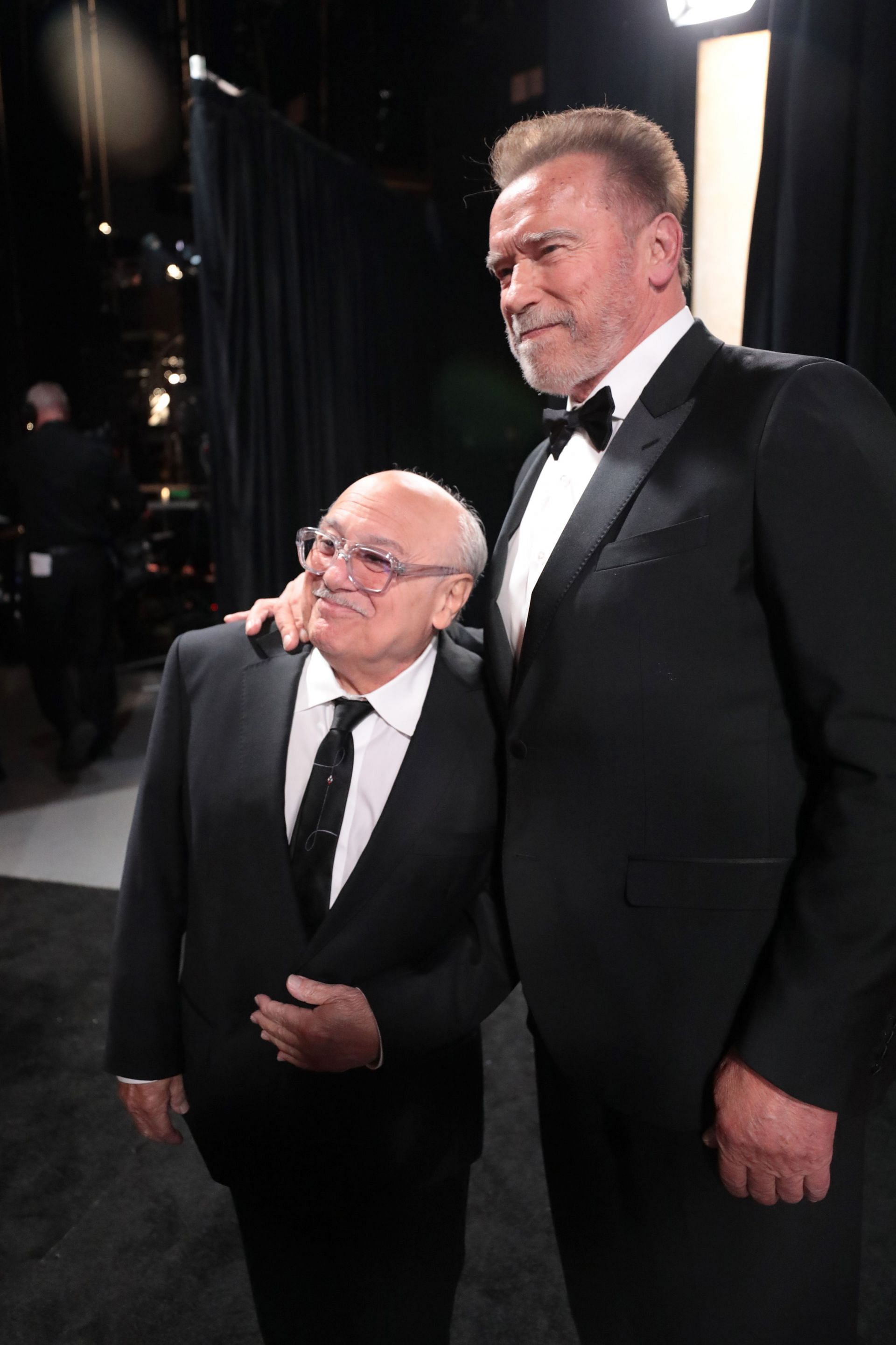 DeVito and Schwarzenegger at the 96th Annual Academy Awards Backstage (Photo via Getty Images)