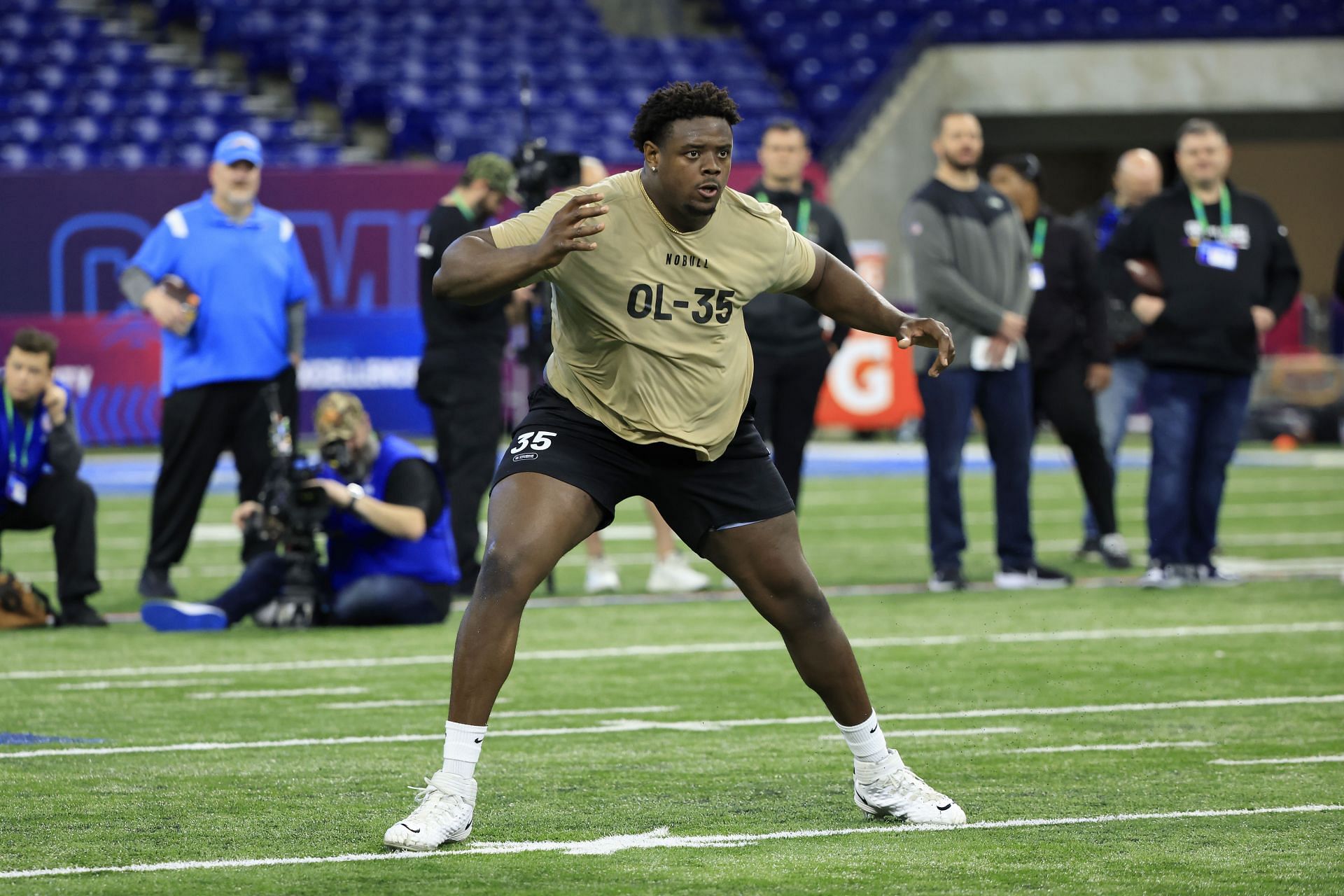 Christian Jones #OL35 of Texas participates in a drill during the NFL Combine