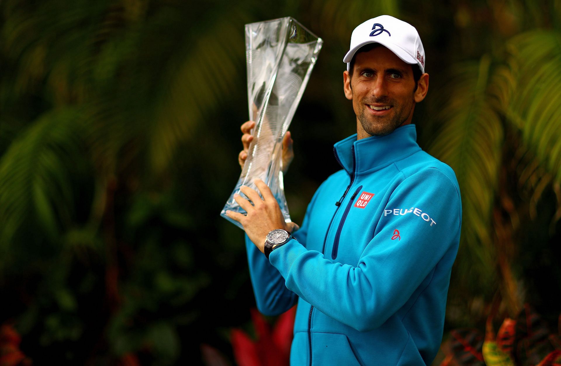 Novak Djokovic poses with the 2016 Miami Open trophy