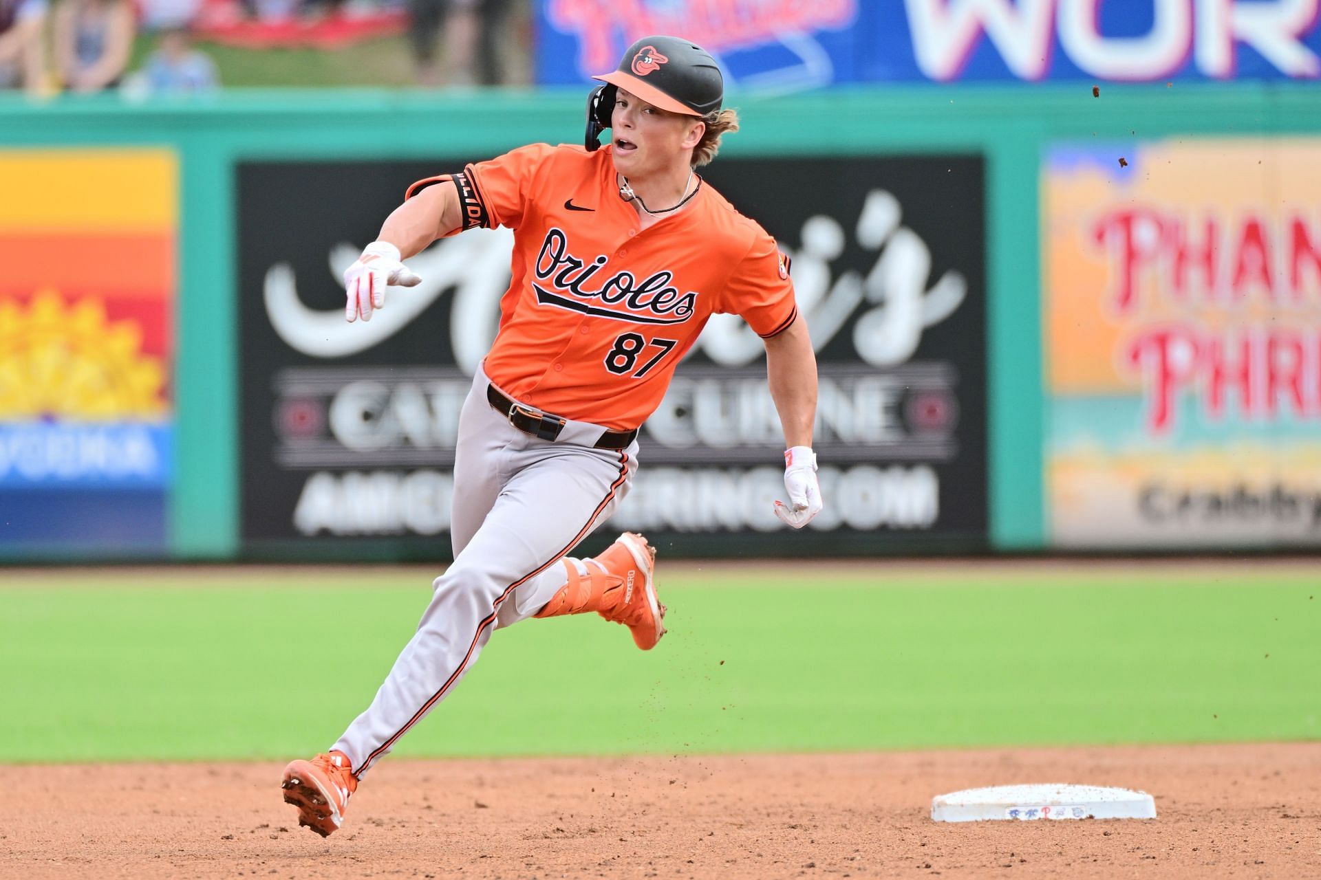 Jackson Holliday of the Baltimore Orioles rounds second base after hitting a triple
