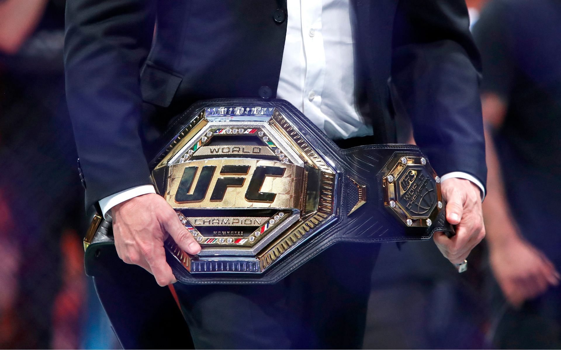 Dana White holding a UFC belt