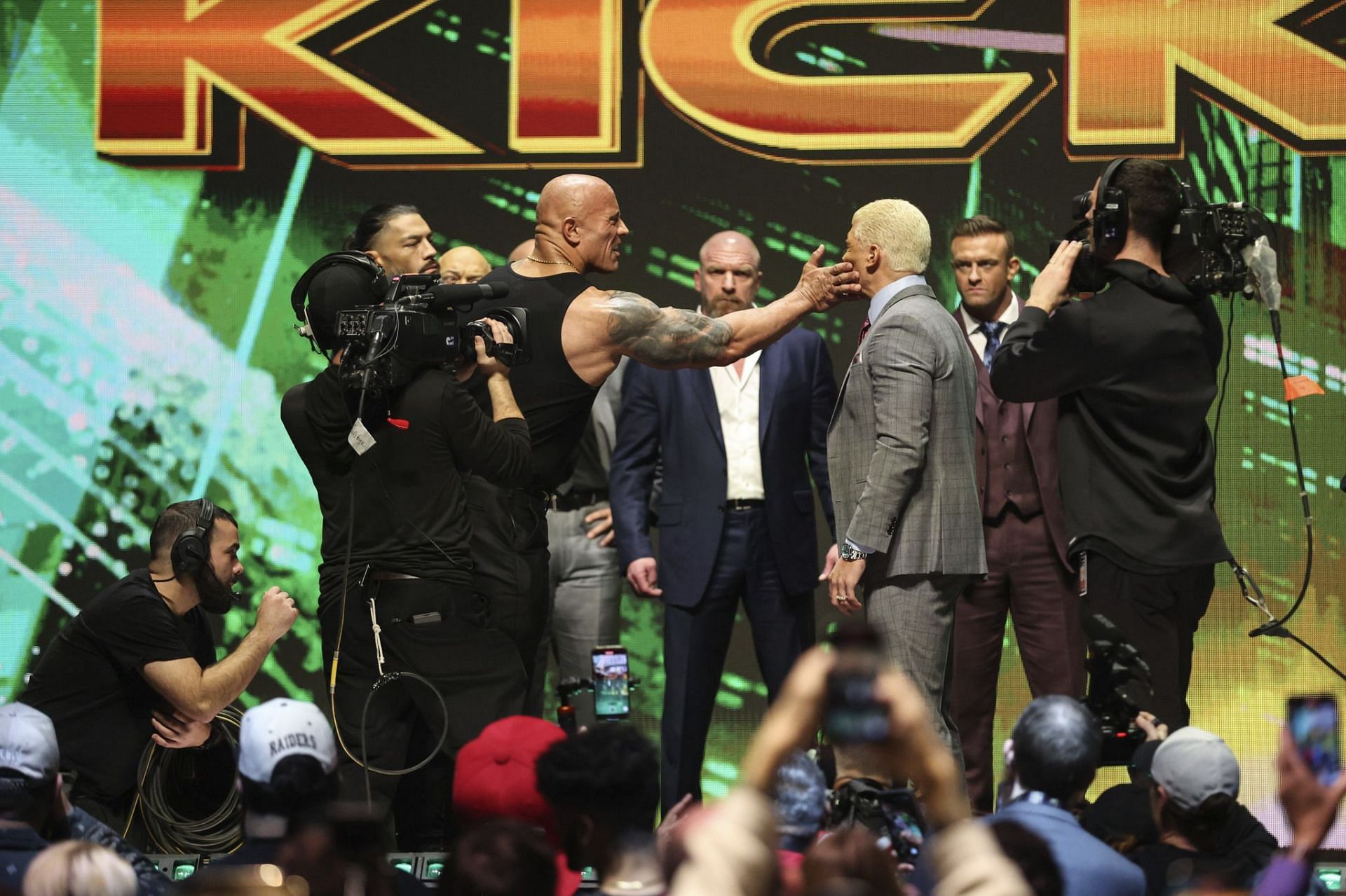 The Rock slaps Cody Rhodes at the WrestleMania Kick-off presser.