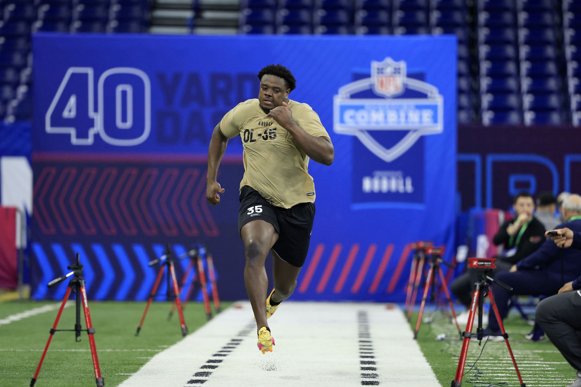 Christian Jones #OL35 of Texas participates in the 40-yard dash during the NFL Combine