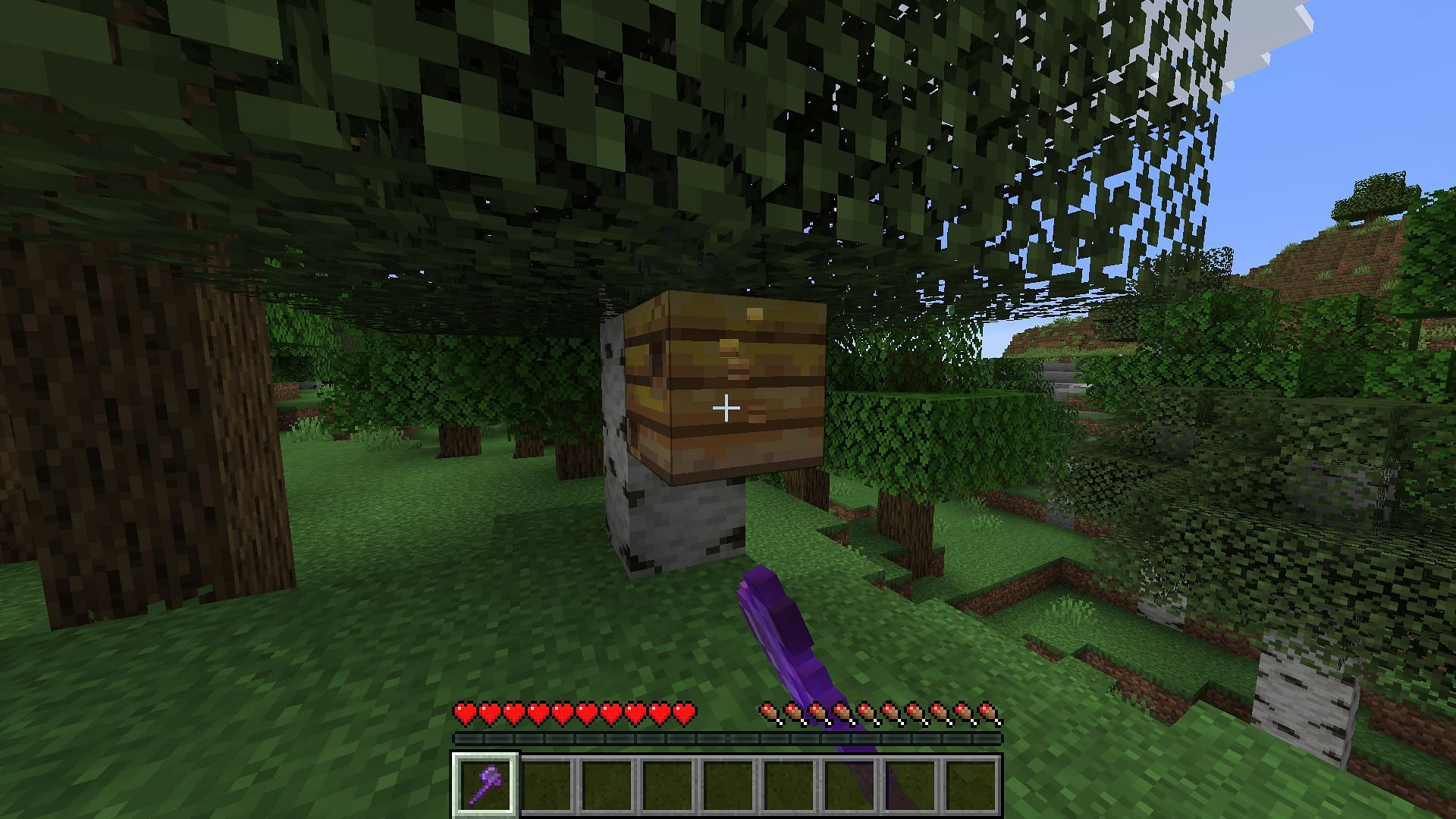 Silk Touch can be used to collect both bees and their nests at once in Minecraft (Image via Mojang)