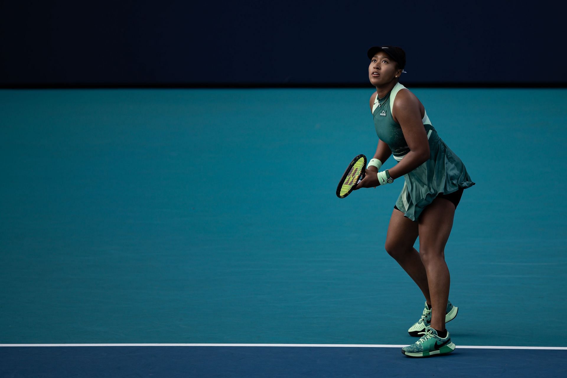 Naomi Osaka preparing to serve against Caroline Garcia at 2024 Miami Open