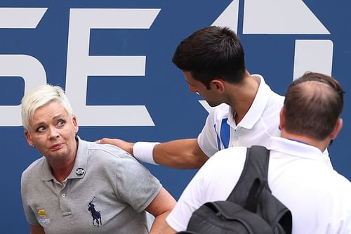 Novak Djokovic and a linesperson at the 2020 US Open.