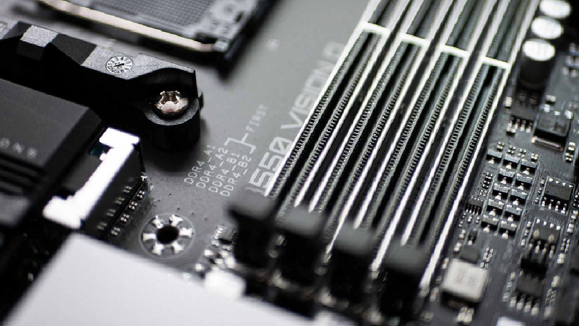 Empty RAM slots on a motherboard (Image via Sven Finger/Unsplash)