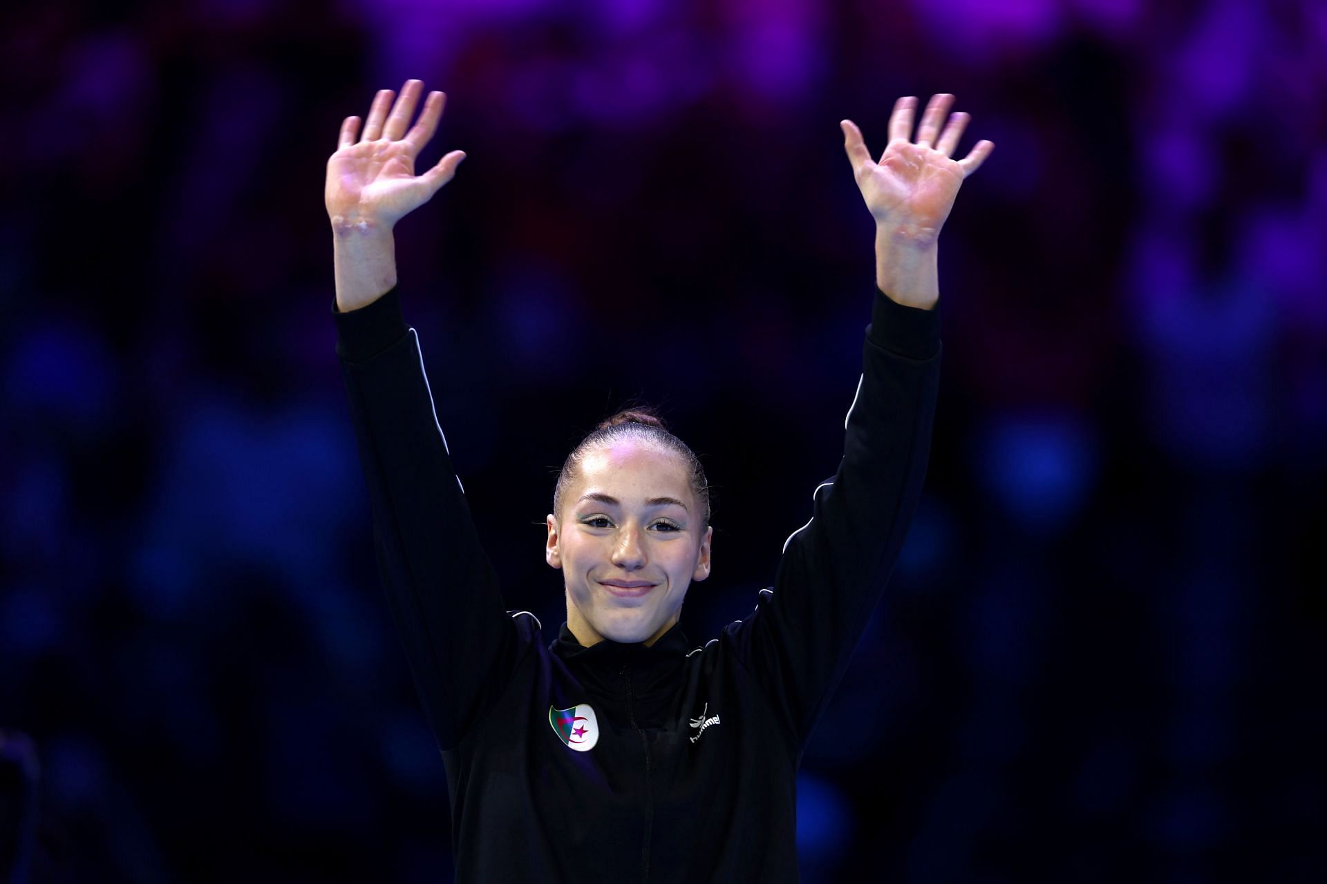 Silver medalist Kaylia Nemour of Team Algeria acknowledges the crowd during the medal ceremony for the Women&#039;s Uneven Bars Final on Day Eight of the 2023 Artistic Gymnastics World Championships at Antwerp Sportpaleis on October 07, 2023 in Antwerp, Belgium. (Photo by Naomi Baker/Getty Images)