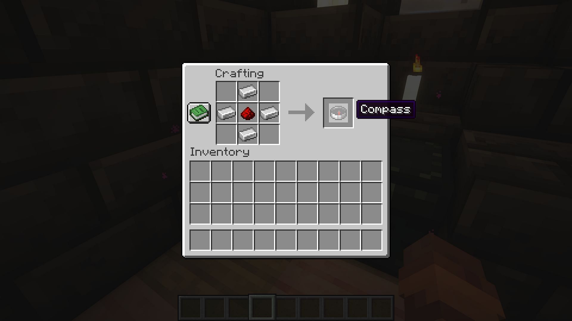 The crafting recipe for a compass (Image via Mojang)