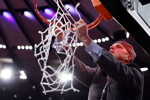 Dan Hurley cuts the net to celebrate victory in the Big East Basketball Tournament - Final