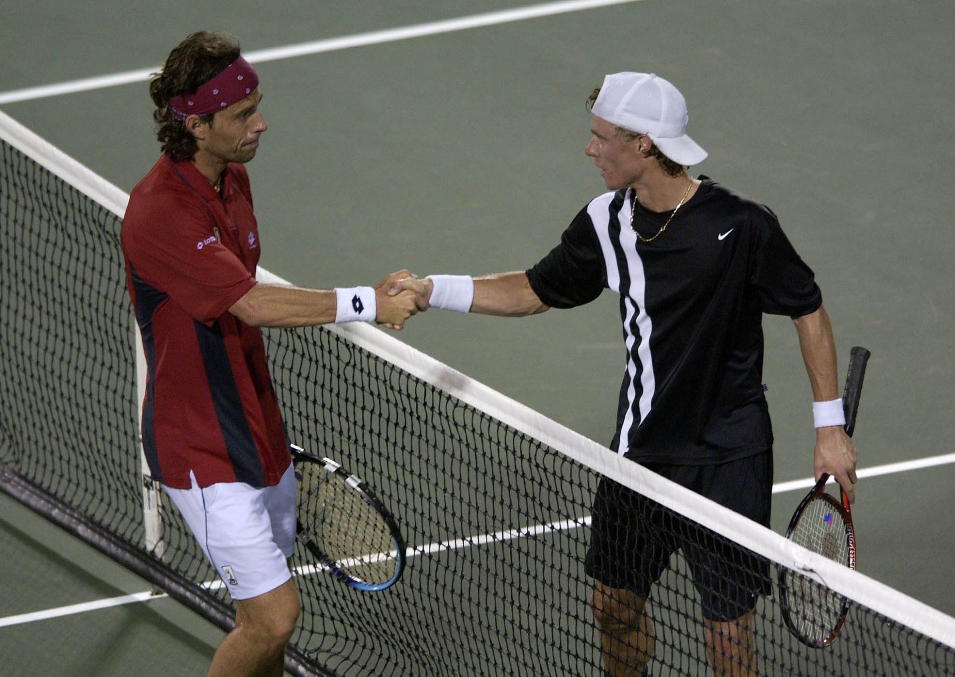 Francisco Clavet is congratulated by Lleyton Hewitt