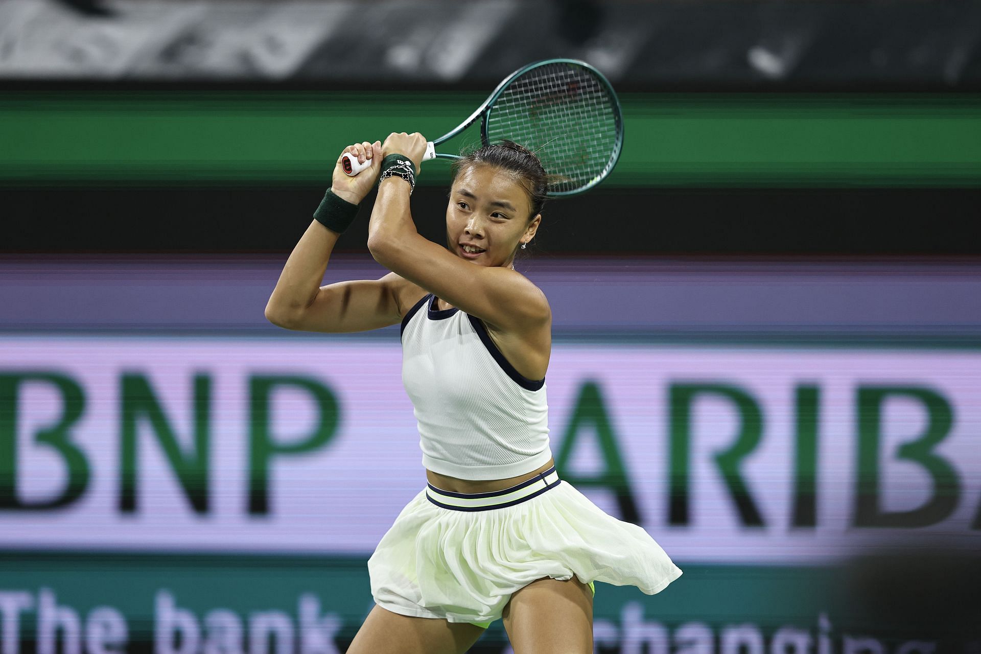 Yue Yuan returns a serve during the BNP Paribas Open 2024