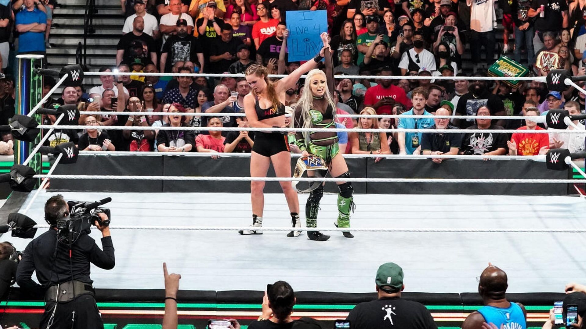 Liv and Morgan at the end of their 2022 Money in the Bank match
