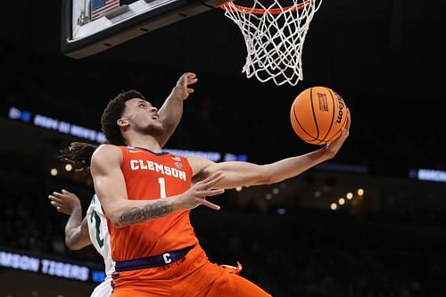 Chase Hunter #1 of the Clemson Tigers shoots the ball past Jayden Nunn #2 of the Baylor Bears.