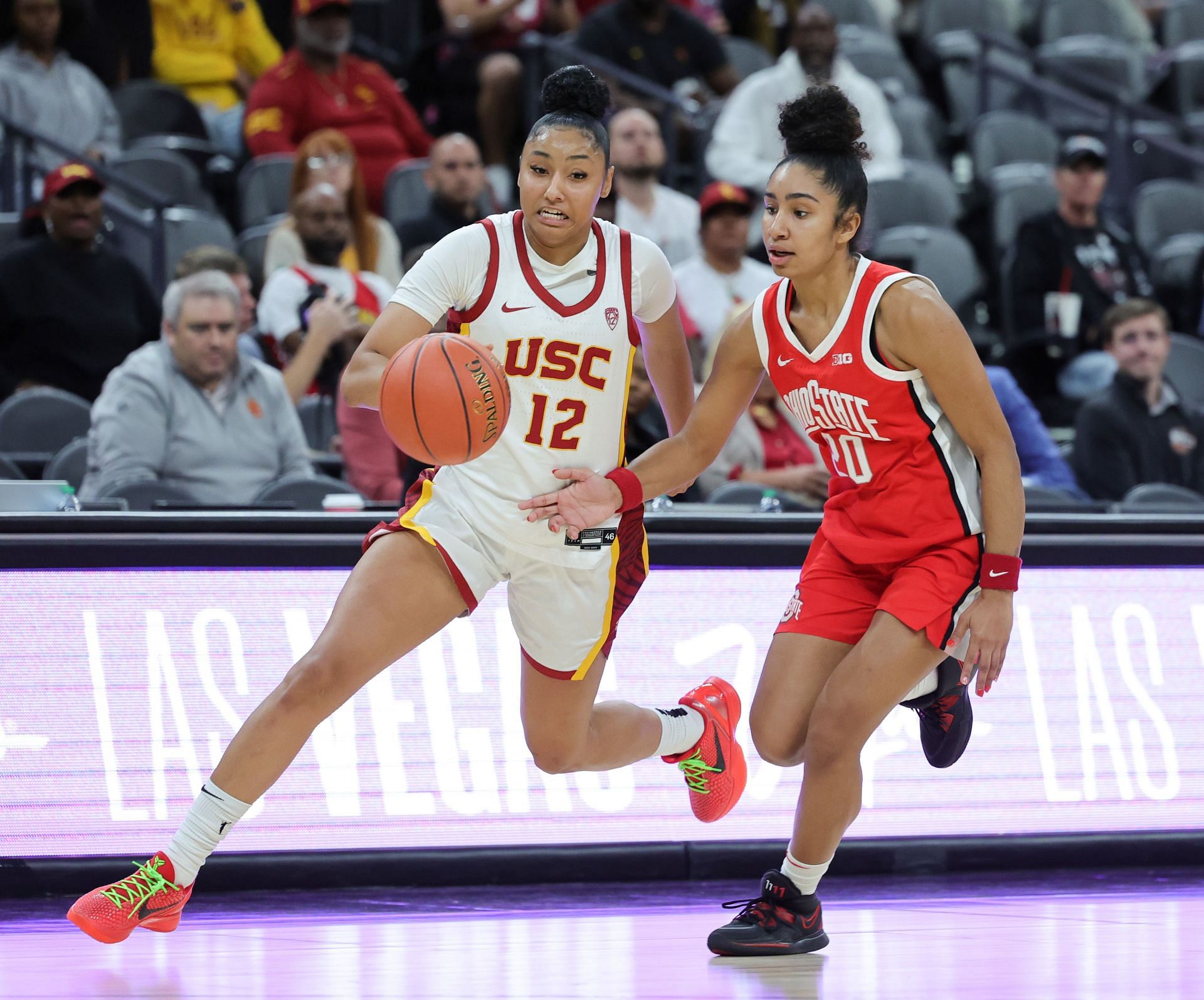 JuJu Watkins #12 of the USC Trojans drives against Diana Collins #20 of the Ohio State Buckeyes in the second half of their game