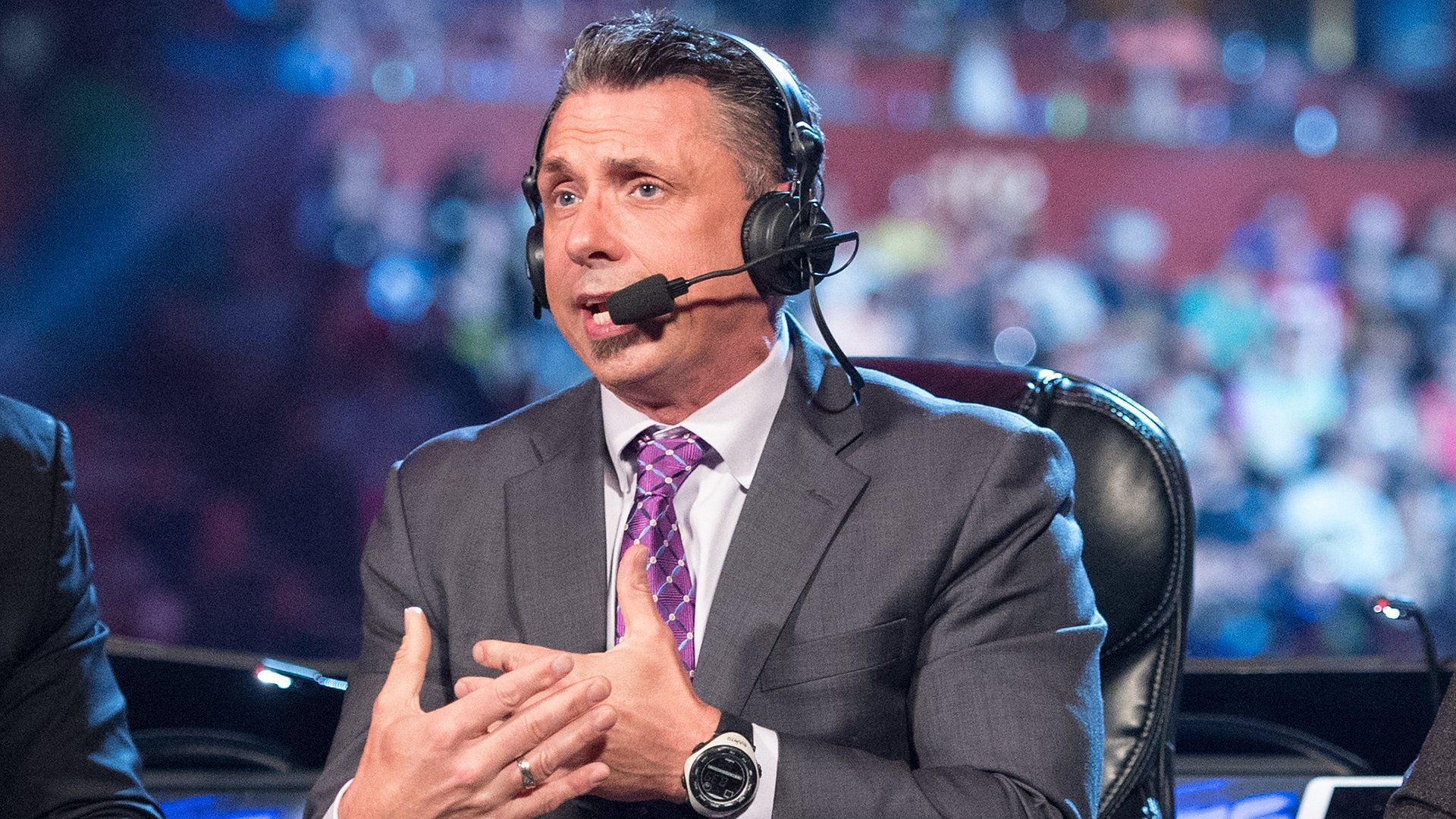 Michael Cole does commentary as The Voice of WWE