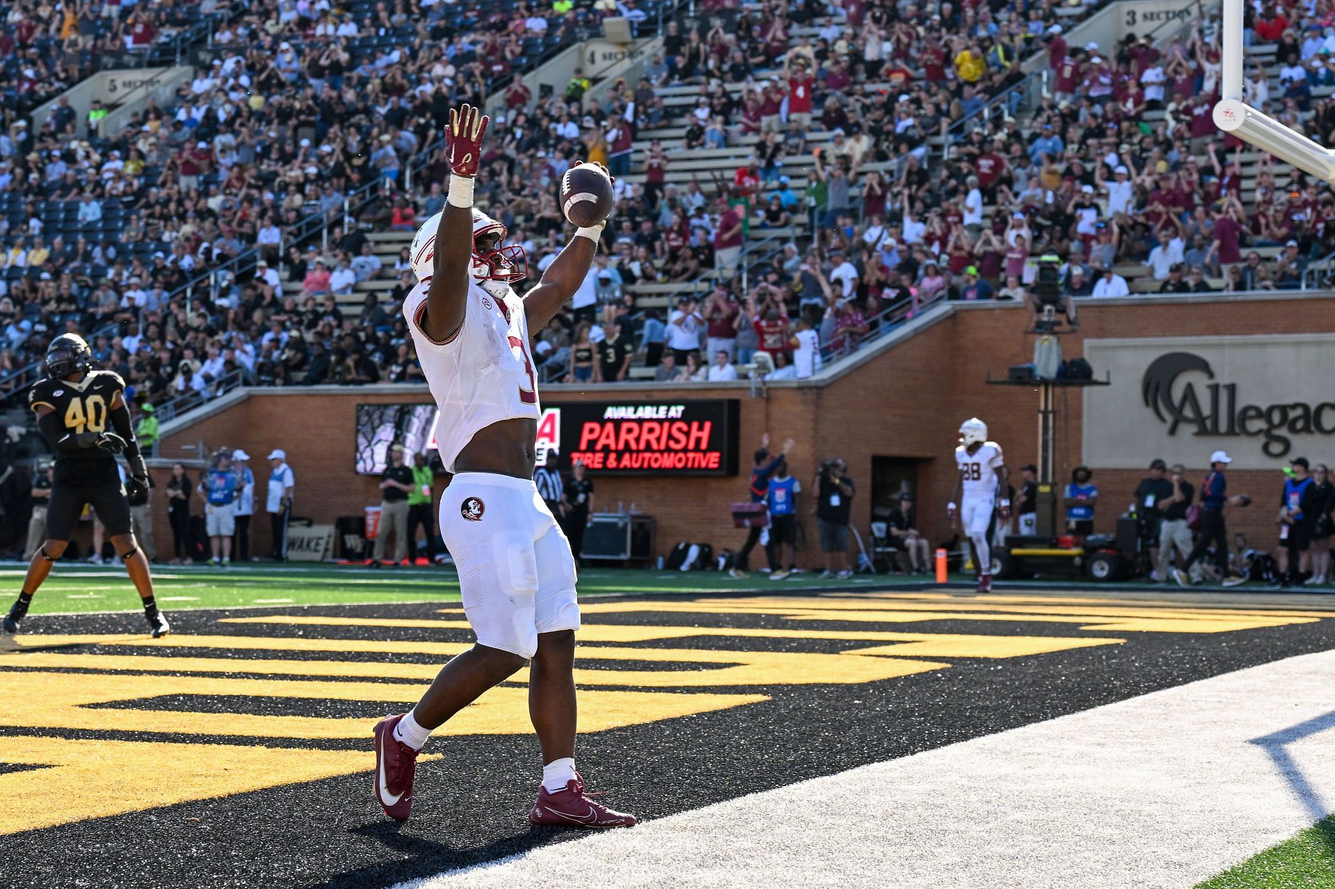 Trey Benson #3 of the Florida State Seminoles celebrates after scoring a touchdown against the Wake Forest Demon Deacons