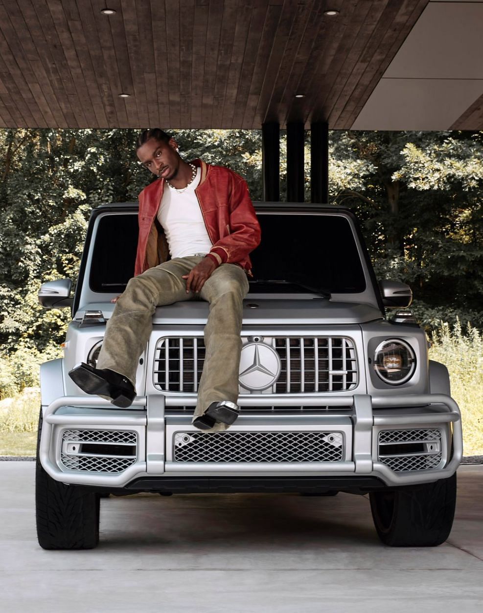 Shai Gilgeous-Alexander models atop a G-Wagon