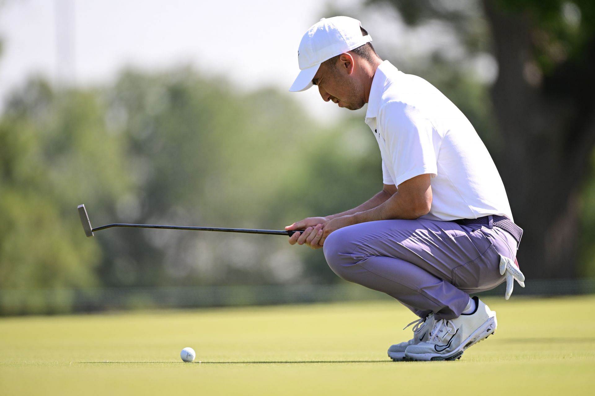 Doug Ghim lines up his putt during the 2024 Texas Children&#039;s Houston Open, Round One