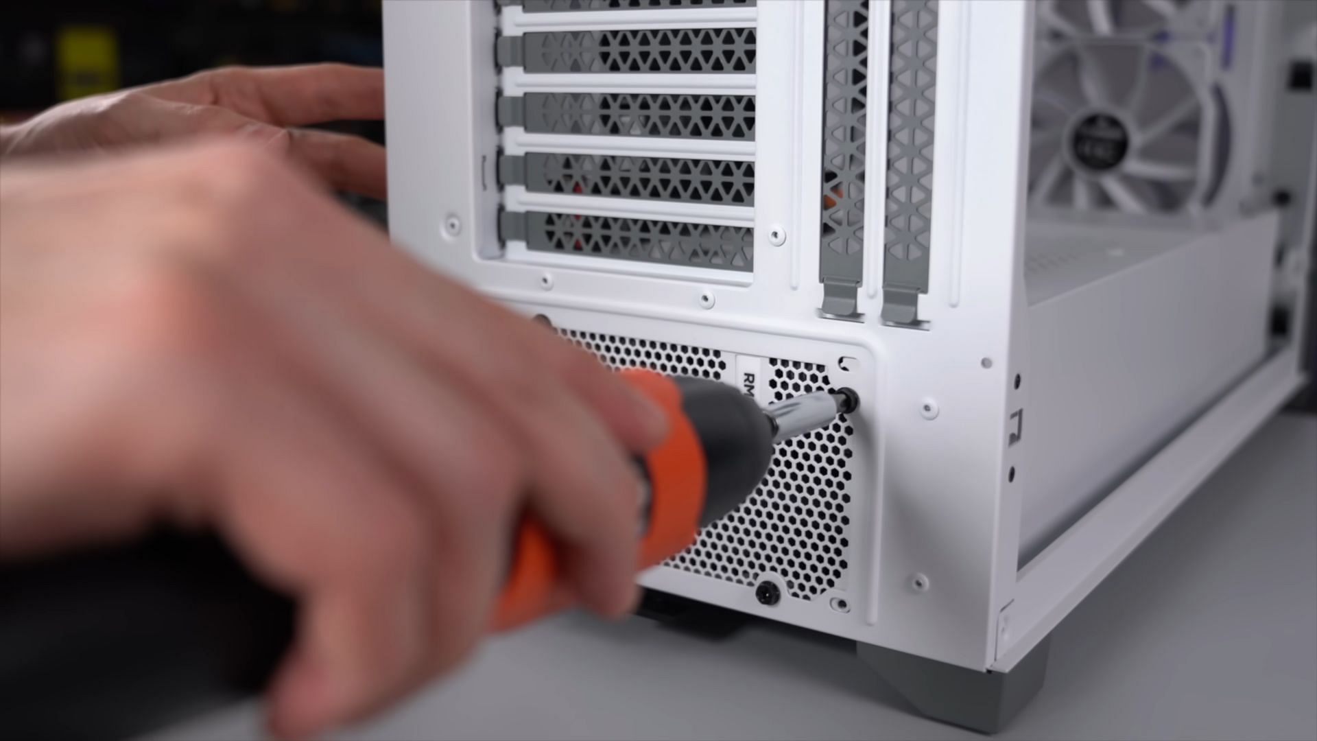 Installation of PSU to build a new gaming PC (Image via TechSource/YouTube)