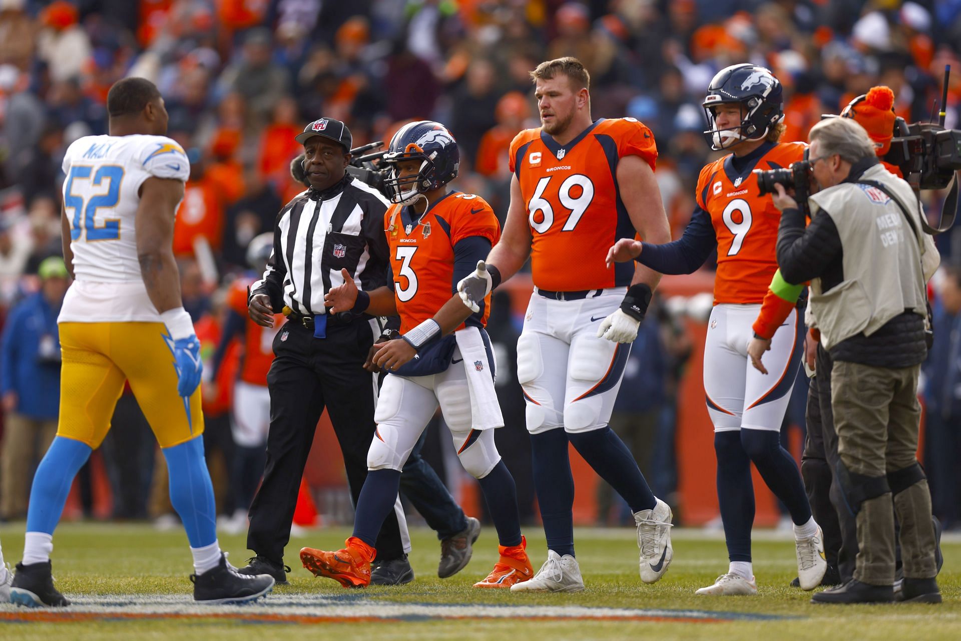 Russell Wilson and Mike Mcglinchey at Los Angeles Chargers v Denver Broncos