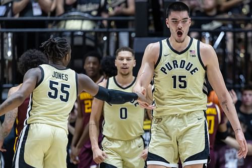 Lance Jones, Mason Gillis, and Zach Edey of the Purdue Boilermakers