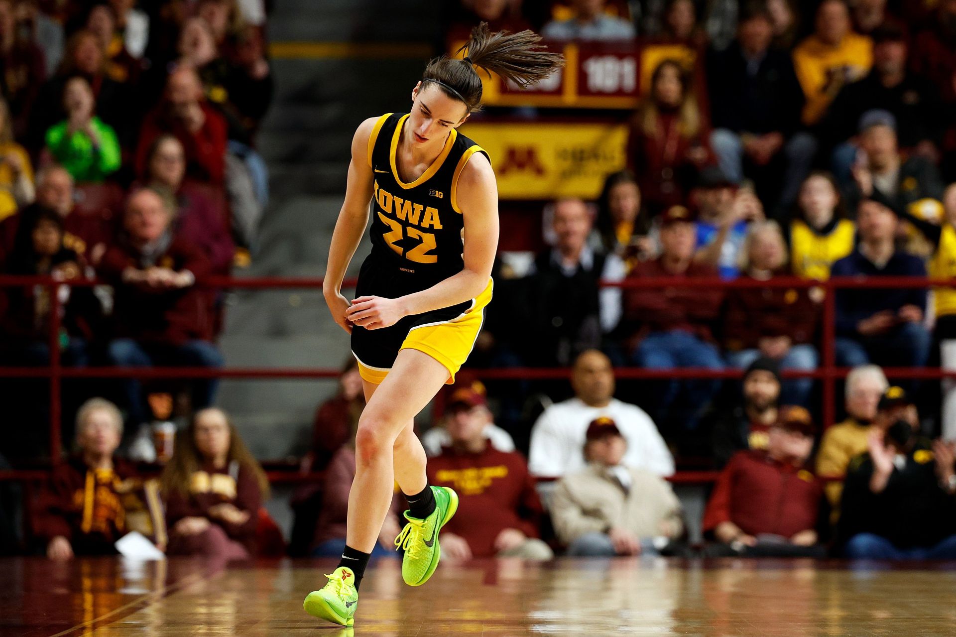 Caitlin Clark of the Iowa Hawkeyes reacts to her basket against the Minnesota Golden Gophers.