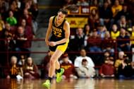 Caitlin Clark of the Iowa Hawkeyes reacts to her basket against the Minnesota Golden Gophers.