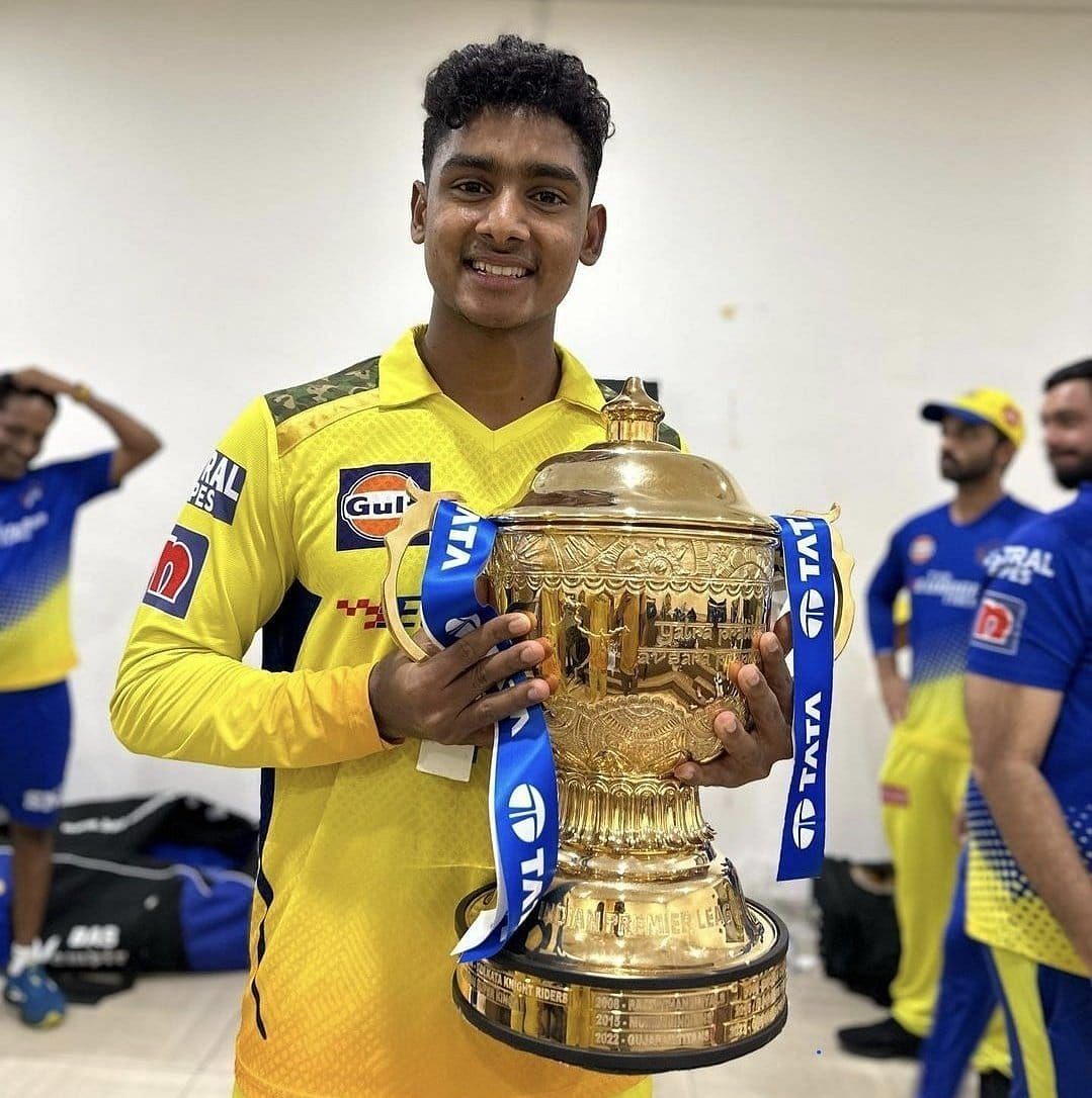 Shaik Rasheed holding the IPL 2023 trophy