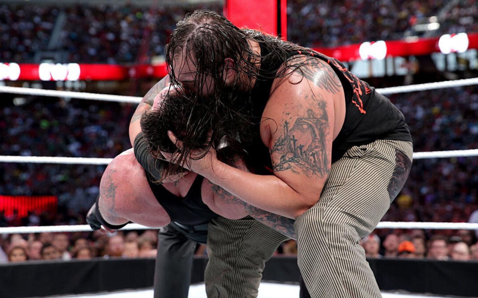 Bray gives The Undertaker a kiss from Sister Abigail [Image Source: WWE.com]