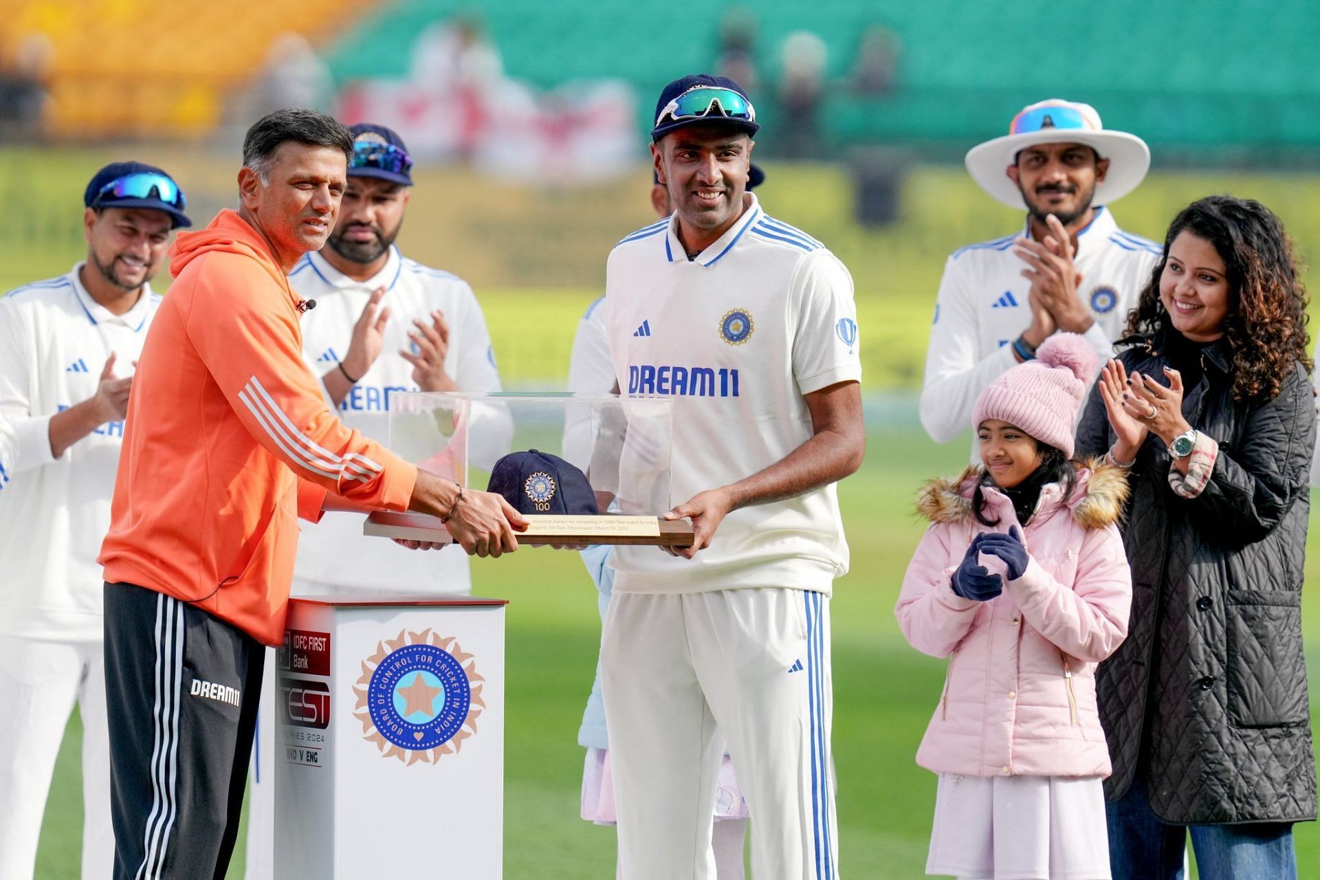 Ravichandran Ashwin recieving the memento for his 100th Test from head coach Rahul Dravid