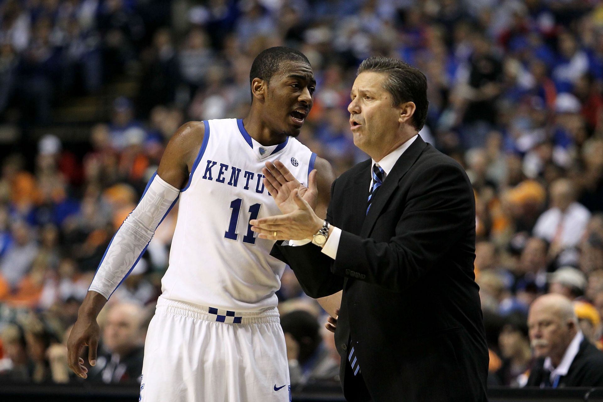 John Wall talks to Kentucky coach John Calipari.