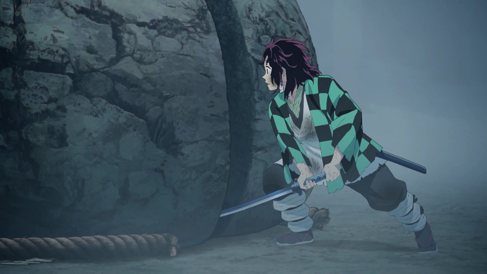 Tanjiro cuts the boulder (Image via Ufotable)