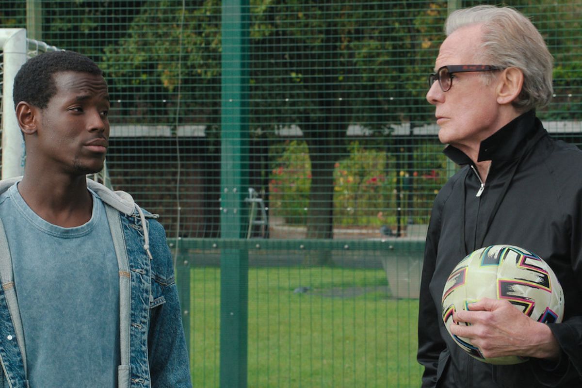 Vinny Walker and coach Mal from The Beautiful Game (Image via Netflix)