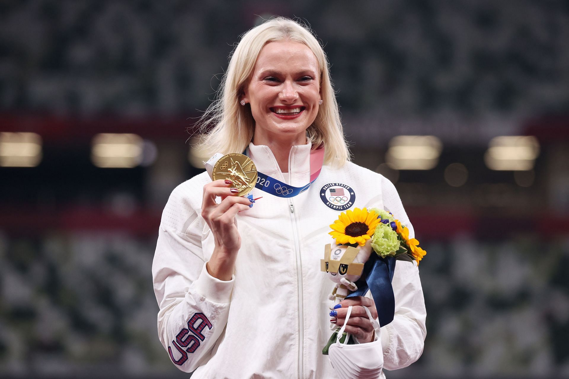 Katie Moon holds up her medal on the podium during the medal ceremony for the Women&rsquo;s Pole Vault during the 2020 Olympic Games in Tokyo, Japan.