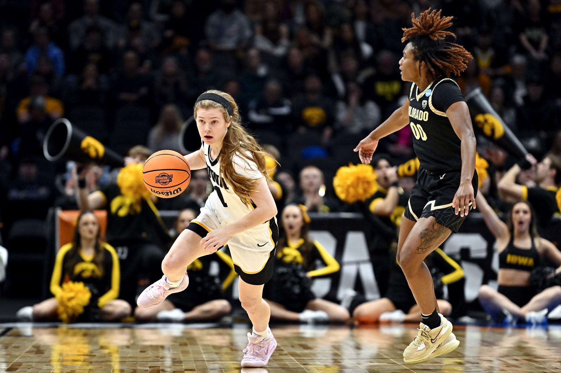 Iowa Hawkeyes star Molly Davis (L)