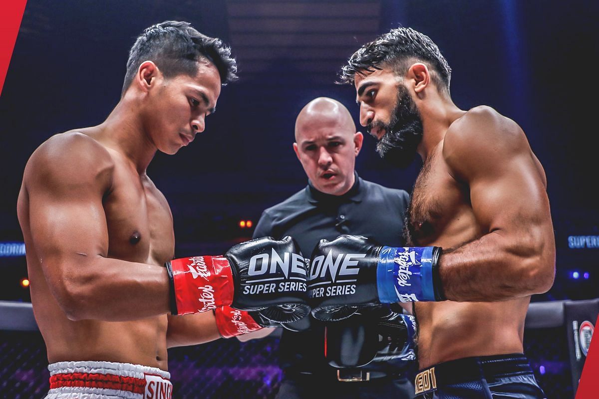 Superbon (left) touches gloves with Marat Grigorian (right) [Photo via: ONE Championship]