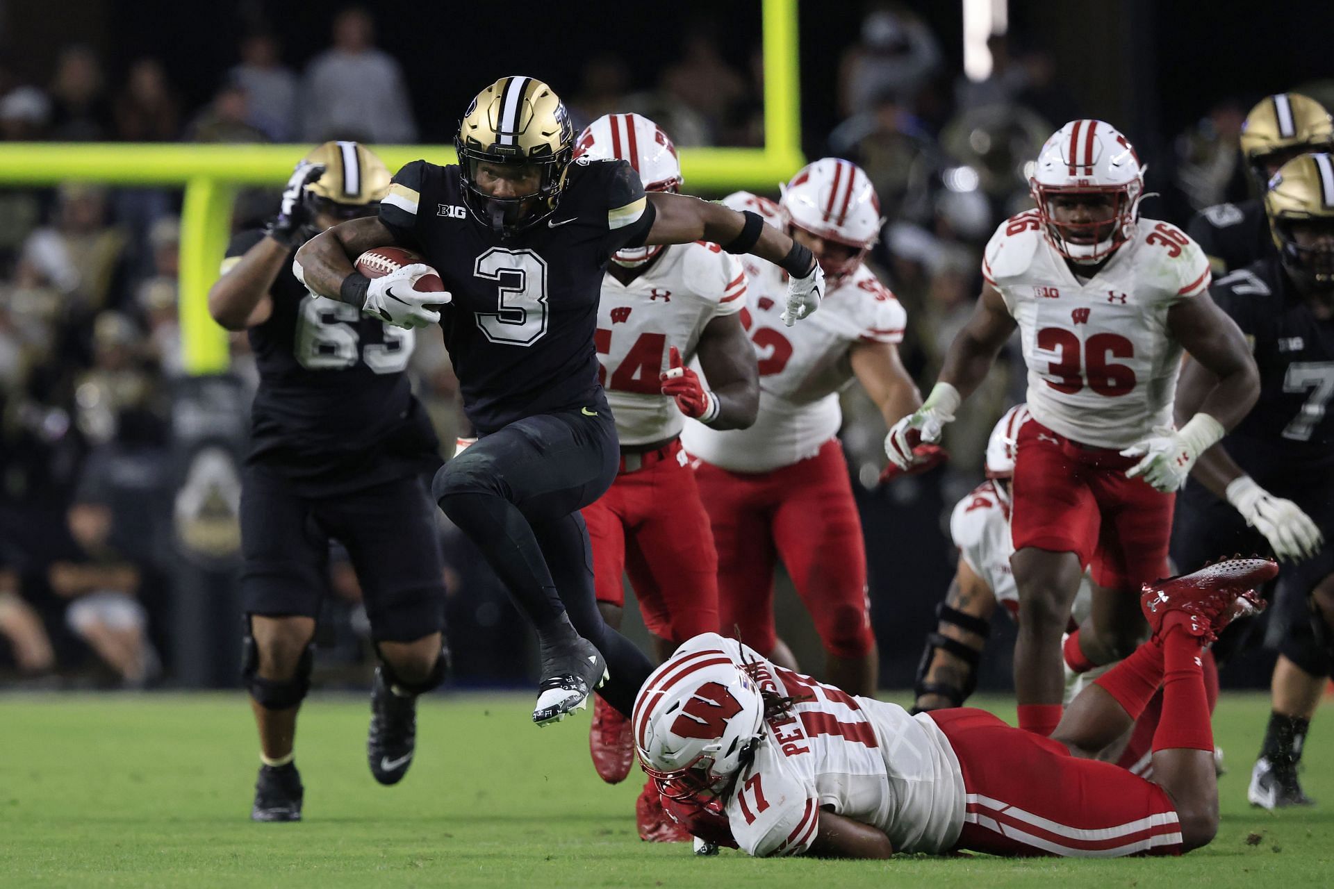 Tyrone Tracy Jr. #3 of the Purdue Boilermakers runs the ball during the second half in the game against the Wisconsin Badgers