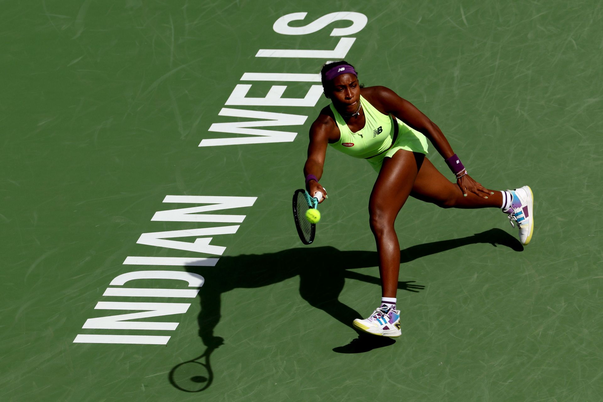 Coco Gauff retrieves a ball at the 2024 BNP Paribas Open