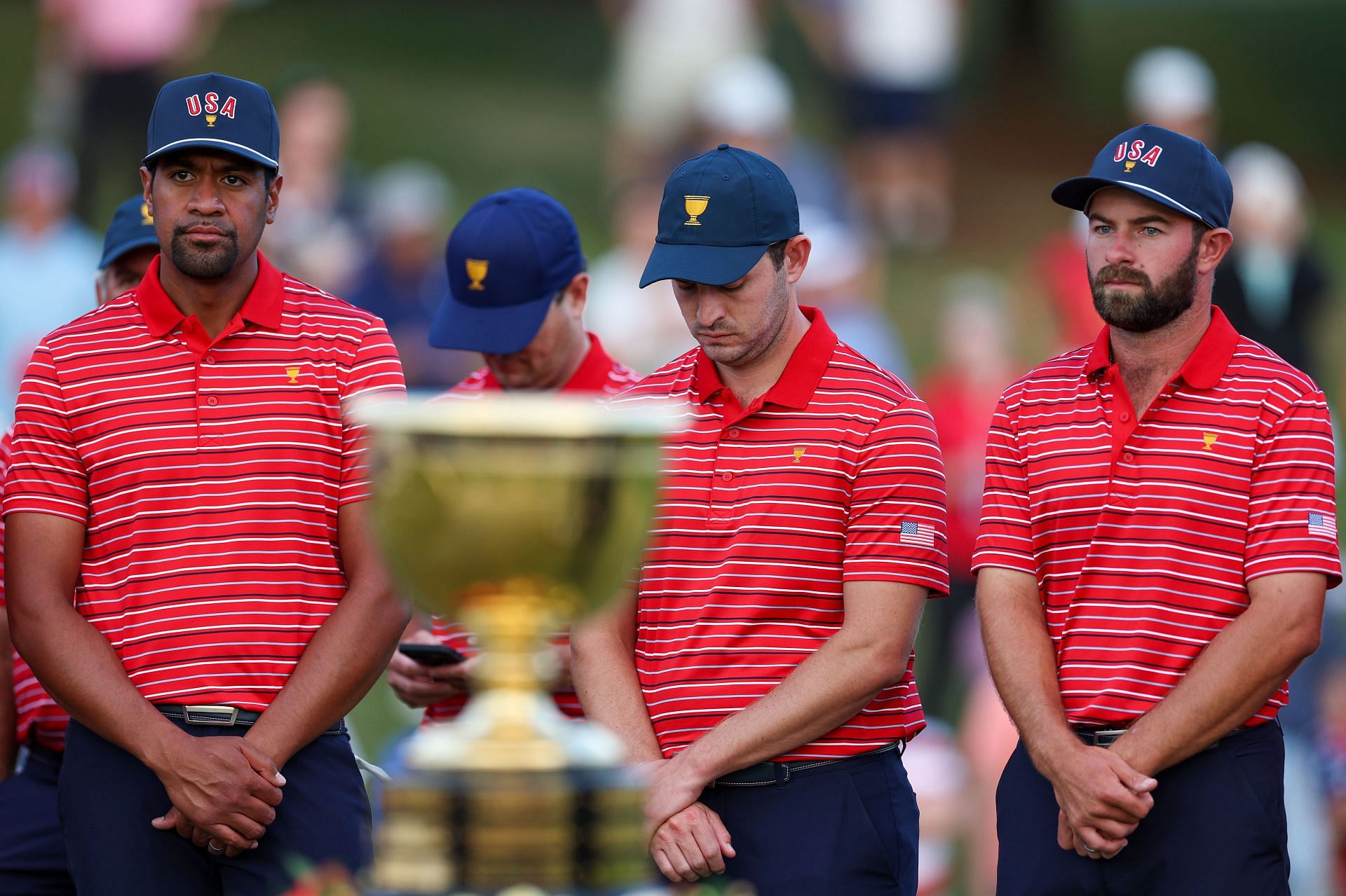 Tony Finau (L) and Cameron Young (R) with Patric Cantlay at the 2022 Presidents Cup